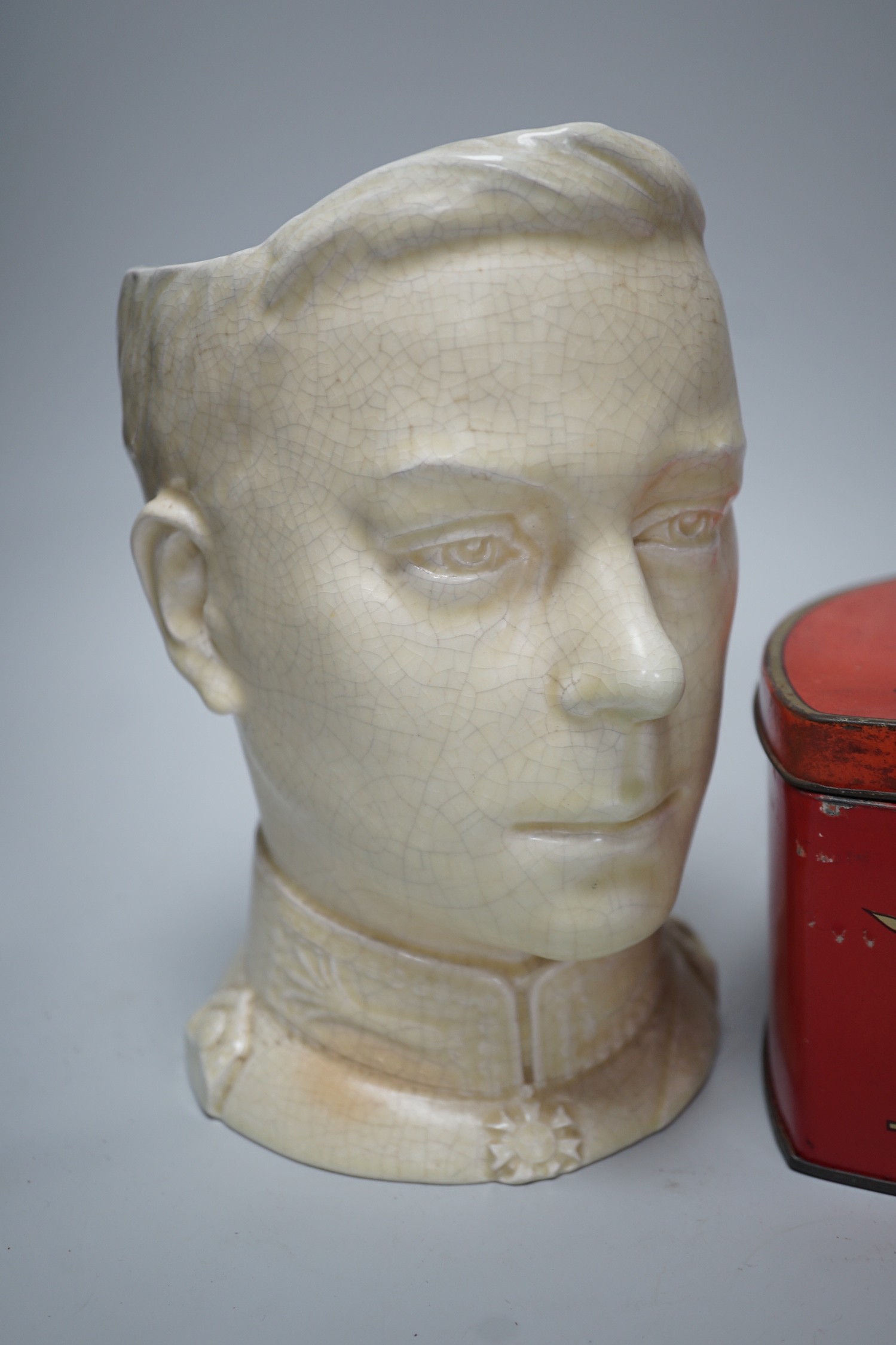 A musical Edward VII Coronation jug playing ' God save the King' and an Edward VIII biscuit tin